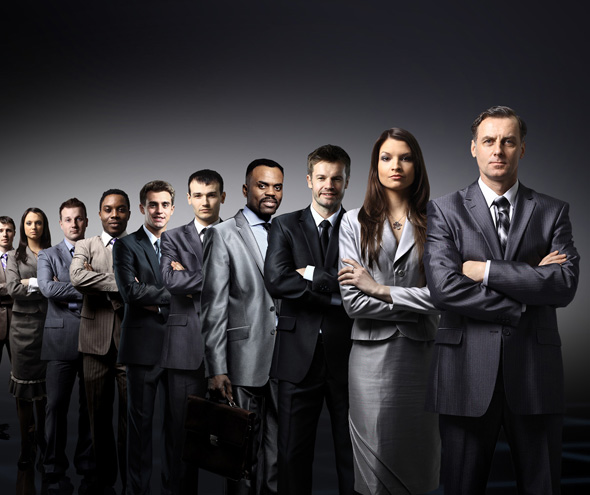 business team formed of young businessmen standing